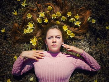 Portrait of a beautiful young woman lying down