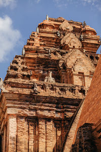 Low angle view of old temple against sky