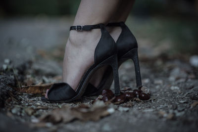 Low section of woman wearing high heels