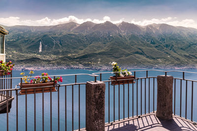 Scenic view of building by mountains against sky