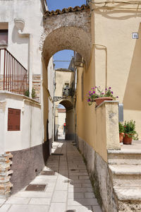 A narrow street among the old houses of irsina in basilicata, region in southern italy.