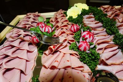 A platter of cold meats as snacks in food catering