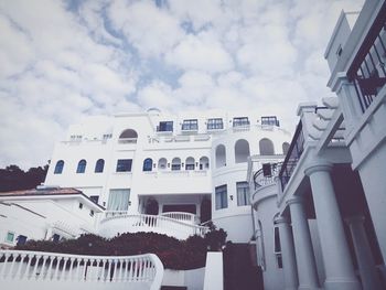 Low angle view of buildings in city against sky