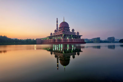 Reflection of mosque in water at sunrise in putrajaya, malaysia