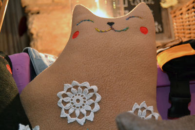 Close-up of cat against wall