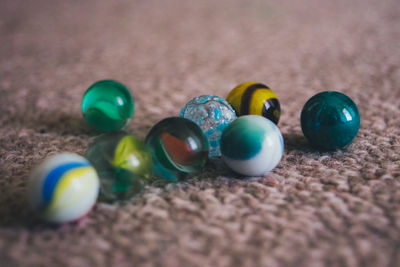 Close-up of multi colored balls on table