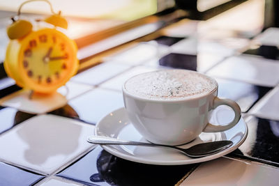 Close-up of coffee cup on table