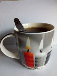 Close-up of coffee cup on table