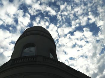 Low angle view of tower against cloudy sky