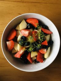 Directly above shot of chopped fruits in bowl on table