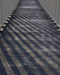 Railing shadow on the bridge or railing casts a shadow in the evening during sunset. abstract