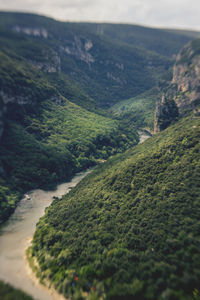High angle view of river flowing through mountain