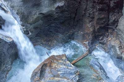 Scenic view of waterfall against sky