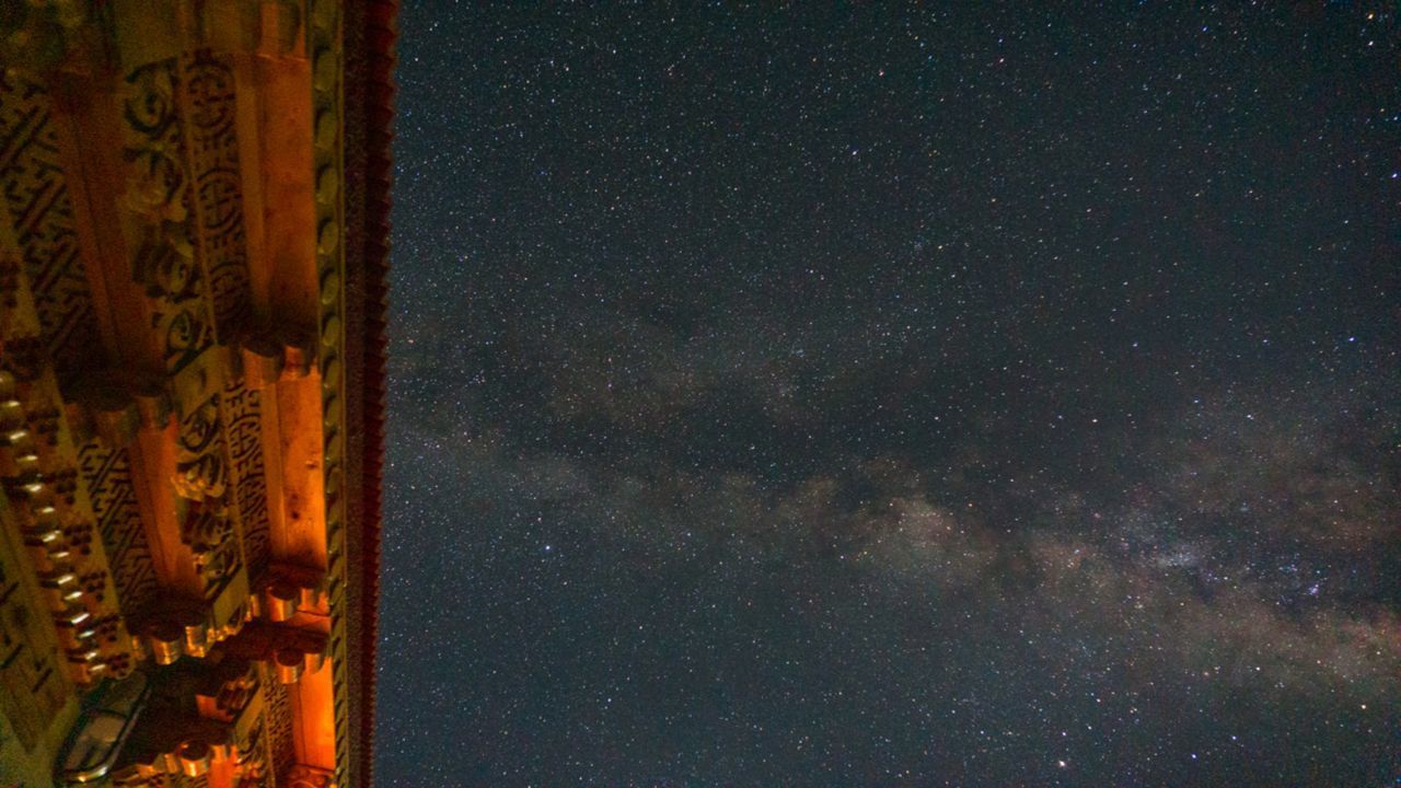 LOW ANGLE VIEW OF STAR FIELD AGAINST SKY