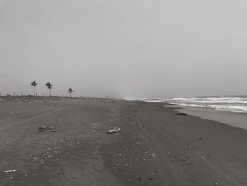 Scenic view of beach against clear sky