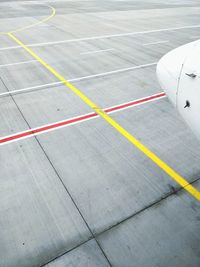 High angle view of airplane on airport runway