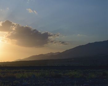 Scenic view of field against sky during sunset