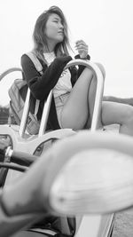 Young woman sitting on chair