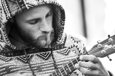 Portrait of man playing guitar