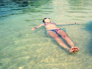 High angle view of woman swimming in lake