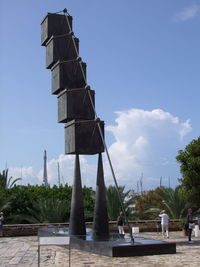 People at observation point against sky