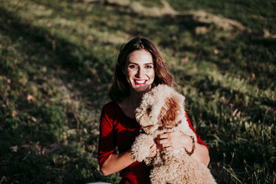 Portrait of smiling woman with dog