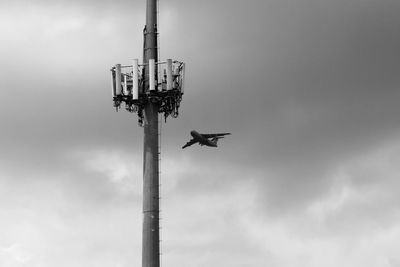 Low angle view of airplane against sky