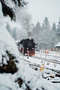 Train on snow covered railroad track