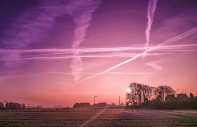 Scenic view of vapor trails in sky at night