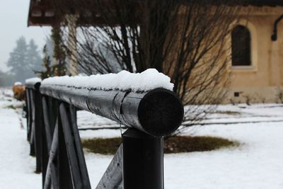 Snow on railing during winter