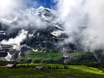 Scenic view of snowcapped mountains against sky