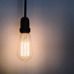Close-up of illuminated light bulb