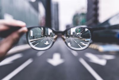 City street seen through eyeglasses