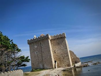 View of fort against blue sky