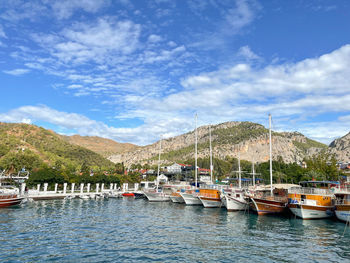 Boats moored at harbor