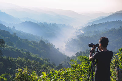 Cameraman enjoying the nature view of hills and mountain are complex in the morning sunrise