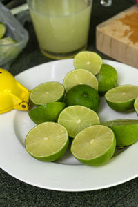 High angle view of fruits in plate on table