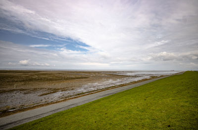 Scenic view of beach against sky