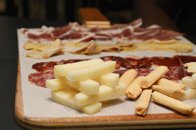 High angle view of chopped bread on cutting board