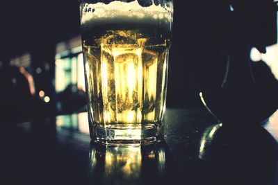 Close-up of beer glass on table