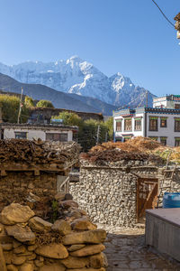 View of buildings against mountain range