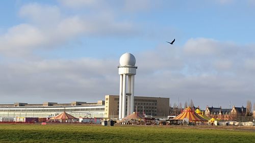 View of buildings against cloudy sky