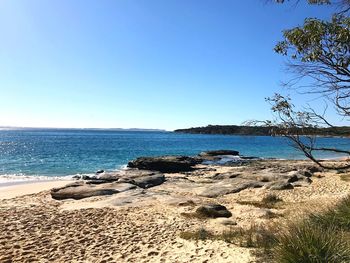 Scenic view of sea against clear blue sky