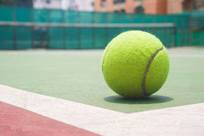 Close-up of green ball at sports court