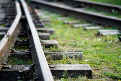 Close-up of railroad track amidst field