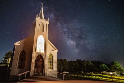 Church against star field at night