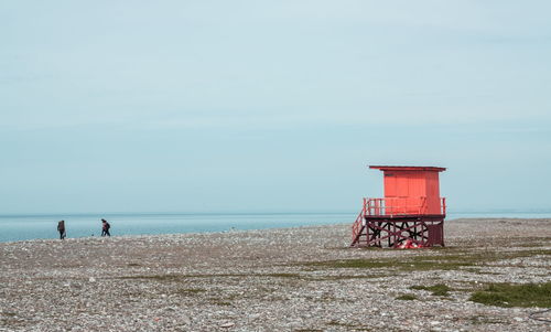 Lifeguard hut against sea at beach