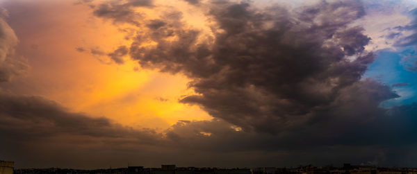 Scenic view of dramatic sky during sunset