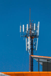 Communications tower against blue sky