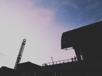 Low angle view of silhouette buildings against sky during sunset